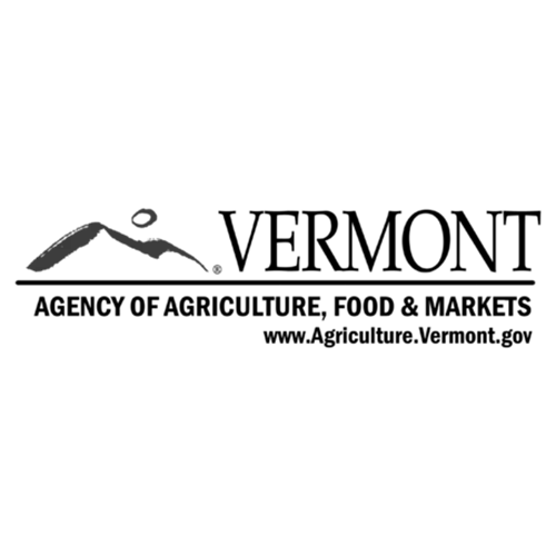 A stylized bird figure above a mountain silhouette.